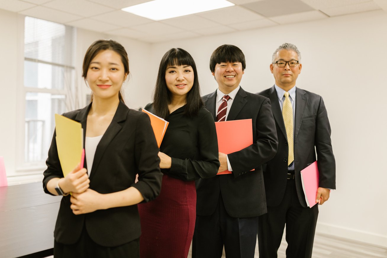 A Group of People Standing in the Office